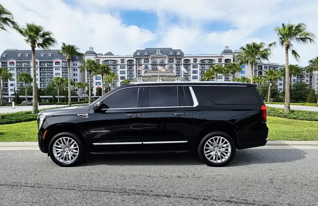 Professional black SUV car service waiting for pickup at Orlando International Airport.