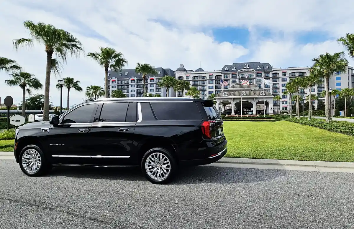 Professional black SUV car service waiting for pickup at Orlando International Airport.