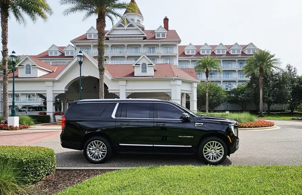 Professional black SUV car service waiting for pickup at Orlando International Airport.