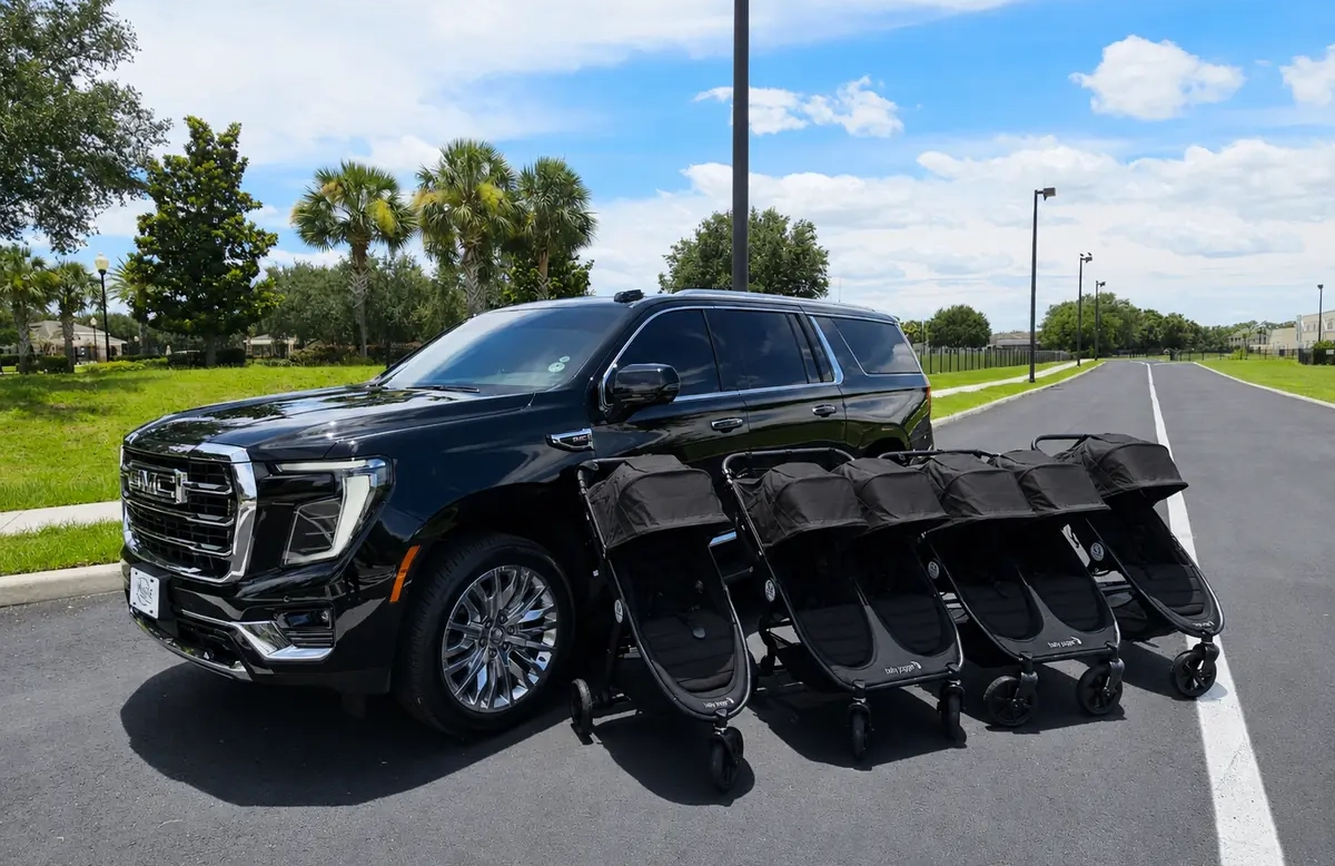 Private family friendly car service pulling up to a Disney World resort with stroller rentals.