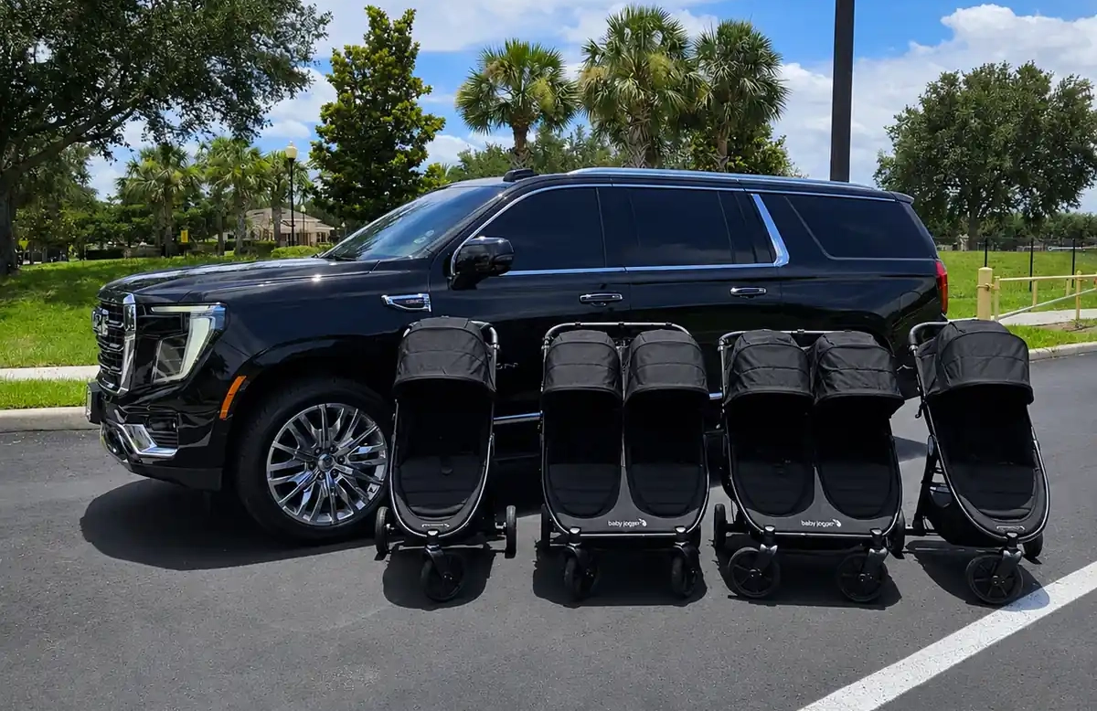 Spacious SUV trunk with ample room for airport luggage and rental strollers.