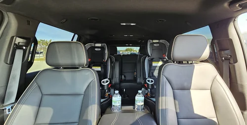 Two clean, properly installed car seats ready for children in a Majestic vehicle
