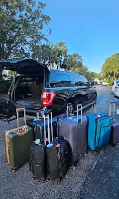 Majestic chauffeur waiting for a family at MCO baggage claim