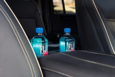 Complimentary bottled water for guests in a Majestic vehicle