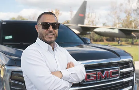Professional uniformed chauffeur for Majestic Private Transportation airport transfers.